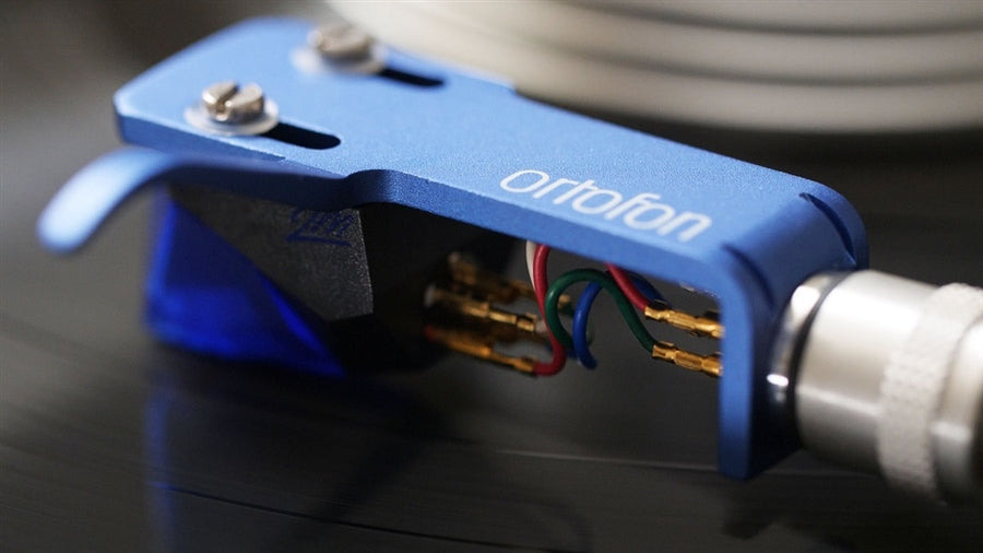 The Ortofon 2M Blue adds more dynamics and resolution, sounds more open and reproduces more detail the the 2M Red
